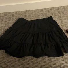 Never Worn. Shein Size Medium. Very Cute And Comfortable Black Cotton Mini Skirt With Ruffles, Black Cotton Ruffled Mini Skirt, Black Cotton Ruffled Skirt, Casual Black Mini Skirt For Day Out, Casual Black Skirted Skort, Black Cotton Skirt For Day Out, Casual Black Skort With Ruffles, Casual Flowy Black Mini Skirt, Casual Black Ruffled Skirt