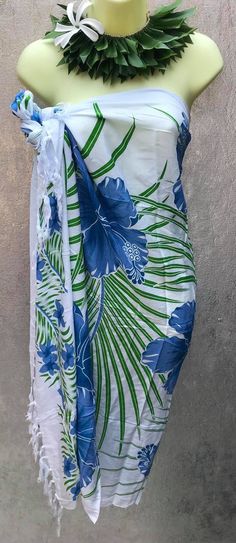 "This sarong/wrap is great for the summer time. This is a 100% rayon sarong, beautiful prints suited for your colorful personality . This versatile sarong can be worn in different ways. Sarong measures approximately 65\" x 43\" lightweight fringe rayon. Please note color, size, and design will vary due to the handmade nature of this item. Guaranteed fast shipping." Green Tropical Print Sarong For Vacation, Tropical Print Sarong For Beach Party, Tropical Printed Sarong For Beach Season, Hawaiian Multicolor Sarong With Tropical Print, Hawaiian Printed Sarong For Beach Party, Hawaiian Style Printed Sarong For Beach Party, Tropical Green Sarong For Beach Season, Green Tropical Sarong For Poolside, Tropical Green Sarong For Poolside