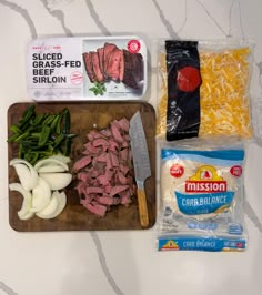 the ingredients for this meal are laid out on a cutting board and ready to be eaten