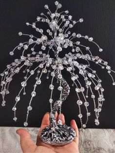 Crystal tree made of crystal beads,wire, acrylic paint,stone base. Size 22 sm.(8 in) This soft and delicate crystal tree symbolizes purity, joy and freshness. Like a fountain with flowing water, it creates an association with an overflowing flow of positive pure energy, harmony and beauty. Bead Trees, Gem Tree, Tree Beautiful, Wire Tree Sculpture, Wire Trees, Handmade Plant, Paper Craft Diy Projects, Wire Tree, Crystal Tree