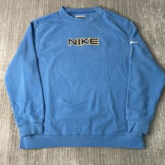 Vintage 2000s Nike Spell Out Swoosh Check Sportswear Athletic Stitched Embroidered Blue Graphic Crewneck Extra Large Mens Condition: Fair Used Condition = Has stain on the back of the crewneck due to wear and age. Measurements: Please see photos above for all measurements IF YOU BUY TWO OR MORE ITEMS USE THE CODE BUNDLE @ CHECK TO SAVE 20% WE SHIP WITHIN 24 HOURS AFTER PURCHASE! Please be aware that we do not offer free returns!! The Buyer is responsible for the cost of the return label.  Follow us on TikTok & Instagram @findsnostalgic and tag us in your finds Vintage Athletic Wear, Vintage Sportswear, Nike Brand, Blue Graphic, Brand Board, Cute Sweatshirts, Vintage 2000s, Saint Paul, Graphic Crewneck