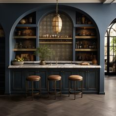 a kitchen with blue walls and wooden floors