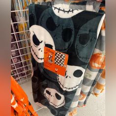 halloween themed blankets are on display in a store