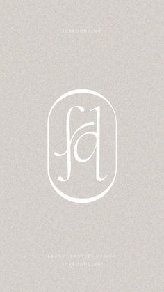 the letter j is inscribed in white on a light gray background with an oval shape