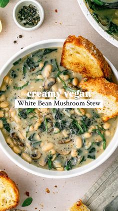 a white bean and mushroom stew in a bowl with toasted bread on the side