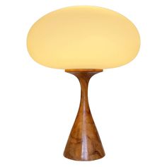 a wooden table lamp with a white light on the top and bottom part of it