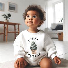 Celebrate Christmas with this sweet piece featuring a baby Pine Tree on a white colored baby sweatshirt romper. This sweet piece is the perfect romper for baby, with an oversized fit. This style runs large, you can size down if you don't prefer this trendy fit. The design is printed on 100% cotton jersey on a sturdy sweatshirt material. It is cozy soft and perfect for staying cuddly.  Please note: the romper is currently available in a NB month through 12-18 month size. This sweatshirt is an ove White Cotton Onesie For Holidays, Holiday White Cotton Onesie, White Long Sleeve Onesie For Holiday, Cute White Christmas Sweatshirt, White Long Sleeve Onesie Gift, White Long Sleeve Christmas Onesie, White Holiday Onesie For Winter, White Winter Holiday Onesie, White Long Sleeve Onesie For First Birthday