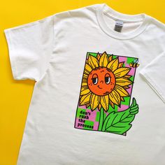 "Sunflower T-Shirt - Unisex Oversized White Tee - 100% Cotton, Eco-Friendly  Grow your own way 👍 White cotton tee with a smiley sunflower print and \"don't rush the process\" quote.  🌻 unisex t-shirt 🧵 100% cotton 👕 relaxed fit ⚖ midweight fabric 203 gsm 🌍 planet friendly 💛 sustainably sourced materials  💧 printed using vegan friendly, water-based inks  🌟 made to order, printed just for you! (a more sustainable method that avoids unnecessary textile waste) 🐳 posted in a plastic free biodegradable mailing bag  ♻ packaging is 100% recyclable after use ©2024 Kio Cards Ltd. All images, artwork and content. All rights reserved. say hi/tag us on Instagram @sixsunflowersdesign" White Shirt With Funny Print For Everyday, Everyday White Shirt With Funny Print, Fun White Everyday T-shirt, Everyday White T-shirt With Front Print, White Oversized Fun T-shirt, White T-shirt With Funny Print For Everyday, T Shirt Printer, Textile Waste, Shirt Design Inspiration