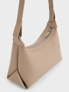 This product is made with at least 20% sustainable materials by weight. CHARLES & KEITH uses recycled, degradable, organic, and water-based materials in our eco-conscious collection. For a casual everyday bag, the Aurelie hobo is a great choice. The sleek trapeze silhouette is balanced by the soft and semi-slouchy construction, creating a relaxed and effortless aesthetic. In light taupe, this neutral-hued carrier will go well with any outfit. It also comes with a thick and adjustable shoulder strap that allows you to wear it as a shoulder bag with a long drop length, or as a casual crossbody bag. Effortless Aesthetic, Taupe Colour, Casual Crossbody Bag, Size Chart For Kids, Charles Keith, Printables Kids, Everyday Bag, Casual Everyday, Belt Size