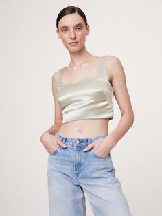 We cut this elegantly understated top from a high-shine satin, keeping the silhouette free from ornament so it’s the perfect blank canvas.  Fitted: Slim.  Sits close to the body.  Square neck.  Invisible zip at back.  Hidden elastic panels at back for a custom fit.  Fully lined.  Fitted: Slim.  Sits close to the body.  Sleeveless.  Cropped length.  Model: Size S, 5'10" (178cm). Elegant Cropped Silk Tops, Satin Cropped Top For Evening, Elegant Silk Cropped Crop Top, Silk Cropped Top For Night Out, Evening Satin Cropped Top, Cropped Satin Top For Evening, Silk Cropped Evening Top, Silk Cropped Top For Evening Wear, Silk Cropped Top For Evening