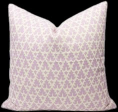 a purple and white pillow with an intricate pattern