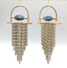 'Elegant' meets 'edgy' in these limited edition hammered arc fringe earrings.  Accented with gorgeous, faceted pietersite or blue kyanite, these unique beauties hang about 3" long and will turn heads for sure :)  Hand-formed hammered brass with antiqued brass chain fringe and the gemstone of your choice.   Choose between pietersite and kyanite:Pietersite is a truly magical & mysterious crystal; a variety of quartz composed [naturally] of a swirling mix of tiger's eye, hawk's eye, and jasper. Bohemian Brass Fringe Earrings, Artisan Metal Chandelier Earrings With Dangle Shape, Artisan Gold Jewelry With Fringe, Metal Fringe Dangle Earrings, Fringe Dangle Metal Earrings, Artisan Fringe Dangle Earrings, Fringe Dangle Chandelier Earrings, Artisan Fringe Dangle Jewelry, Artisan Dangle Fringe Jewelry