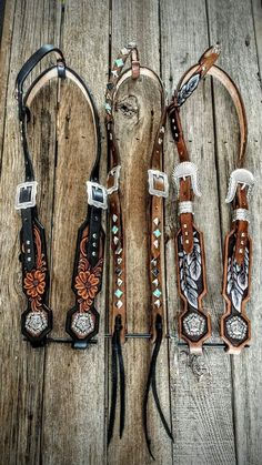 four different types of western style leathers on wooden planks with turquoise beads and silver accents