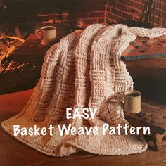 an easy crochet basket weave blanket pattern on a wooden table next to a fireplace