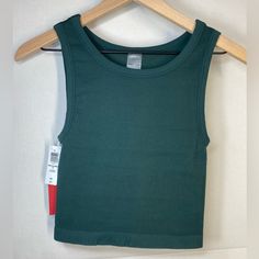 Sunday Best Sinchseamless Crew Tank (Scarab) This Is A Ribbed Scoop-Neck Tank. It’s Made From Sinchseamless A Stretchy Fabric With A Second-Skin Feel And Body-Hugging Fit. Fitted Green Top With Seamless Design, Green Seamless Scoop Neck Tops, Green Sleeveless Seamless Top, Green Ribbed Fitted Crop Top, Fitted Green Seamless Crop Top, Baby Pink Crop Top, Black Satin Top, Scarf Blouse, Ruffle Crop Top