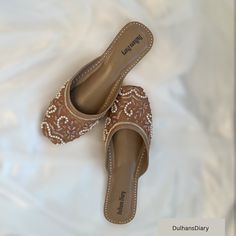 Our Khussas are meticulously crafted using traditional techniques from Pakistan and India, featuring intricate thread zardozi and beadwork. With their luxuriously soft soles, these khussas provide unparalleled comfort, making them a perfect option for special events such as weddings, bridal showers, birthdays, family gatherings, or any memorable occasion. Our shoes are available in US sizes and are true to size. Nevertheless, we understand that each customer may have unique foot characteristics. Festival Wedding Sandals With Round Toe, Closed Toe Sandals For Wedding And Festive Occasions, Festive Closed Toe Sandals For Wedding, Elegant Sandals With Gota Work For Wedding, Brown Open Toe Sandals For Wedding, Traditional Summer Wedding Shoes, Traditional Closed Toe Wedding Sandals, Elegant Flats With Dori Work, Traditional Festive Sandals For Party