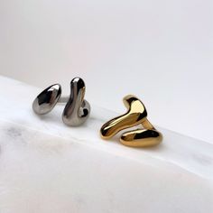 Make a statement with this Fluid Ring! With its bold, droplet-like design and edgy open style, this cute and super trendy ring will have all your friends asking where you got it! Materials: Stainless Steel - Tarnish Free Measurements: 20mm wide at longest part Available in sizes 6-9 Trendy Ring, You Get It, Got It, Stainless Steel, Ring, Silver, Gold, Design