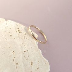 Elevate your style with our handcrafted 14k gold-filled stacking ring. Each ring is meticulously crafted, ensuring that every piece carries the artistry of handmade excellence. The result? A one-of-a-kind ring, as unique as you. This can be your everyday ring. Handcrafted in USA Sold by one ring DETAILS: Material: 14/20 Gold filled Dimensions: Width 1.3mm Note: As each piece is totally handcrafted dimensions and shapes can slightly vary ensuring no two are exactly alike. Extraordinary Jewelry, Everyday Ring, Gold Bond, Everyday Rings, One Ring, Halo Ring, Halo Rings, Oils For Skin, Stacking Ring