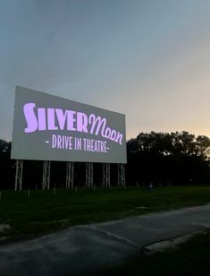 a large billboard with the words silver moon drive in theatre on it's side