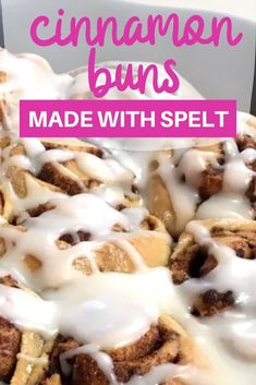 cinnamon buns with white glaze on top in a baking pan and text overlay