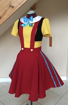 a red dress with yellow and blue trims