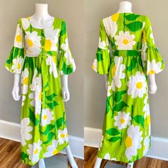 Adorable 1970s Malia Honolulu maxi dress. It is made of a substantial ribbed cotton in green with huge daisies print. It has an empire waist with matching fabric tie belt, fabric covered buttons down the front, 3/4 length puffed sleeves.  Great & clean condition, there are some scattered spots throughout - they are faint and small - some on the back of one of the puff sleeves, one on the fabric belt SIZE : tag size 8, fits like an Xs  Measurements - Bust : 32 Waist : 26 (empire) Hips : 36 Length 1970s Fitted Green Maxi Dress, Green Fitted Maxi Dress 1970s Style, 1970s Style Fitted Green Maxi Dress, Fitted 1970s Style Green Maxi Dress, Retro Green Floral Print Maxi Dress, Vintage Green Spring Maxi Dress, Vintage Green Maxi Dress For Spring, Vintage Green Maxi Dress For Summer, Spring Vintage Green Maxi Dress