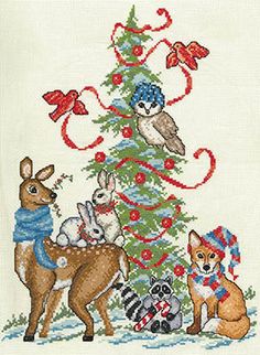 a cross stitch christmas tree with animals around it