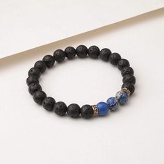 Benefits The Blue Regalite Himalayan Stone Bracelet includes both Lava Stone beads and Blue Regalite beads. Blue Regalite is a grounding, strengthening stone that promotes stability, clarity, and inner-peace, making it ideal for encouraging compassion, contentment, and tranquility. The lava stone also known as “basalt” is a porous volcanic rock that has been solidified from molten lava after conditions of intense heat and pressure. Materials We carefully design, test and ensure the quality of ou Blue Casual Bracelet For Meditation, Casual Blue Bracelet For Meditation, Lapis Lazuli Round Beads Bracelets For Meditation, Hand-strung Lapis Lazuli Bracelets For Meditation, Hand-strung Lapis Lazuli Bracelet For Meditation, Healing Lapis Lazuli Beaded Bracelets With Natural Stones, Spiritual Lapis Lazuli Beaded Bracelet With Natural Stones, Adjustable Lapis Lazuli Beaded Bracelets For Meditation, Spiritual Lapis Lazuli Bracelets For Meditation