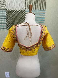 ❥ Handmade Designer stitched blouse ; Can be used for sarees / Lehengas. ❥ Ready to ship (Price mentioned is for Size 34-38)  ❀❀ Return / Exchange Policy :  ※ No Return/ No Exchange / No Cancellation! ※We need proof of video while package is opening for considering any case of missing or damaged products ;  ※ We can not accept any returns , if video at the time of package opening is not provided by the client . ღ ღ Please be courteous and don't ask for negotiation on prices ! We define prices ba Yellow Unstitched Blouse With Cutdana Details, Designer Yellow Choli With Motifs, Yellow Bollywood Designer Blouse Piece, Yellow Blouse With Resham Embroidery For Puja, Unstitched Yellow Blouse For Navratri, Yellow Anarkali Choli With Motifs, Yellow Bollywood Blouse Piece For Navratri, Bollywood Yellow Blouse Piece For Navratri, Yellow Unstitched Designer Blouse Piece