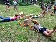 children playing with balls in the yard while adults watch