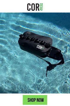 a black bag floating on top of a swimming pool with the words cor above it