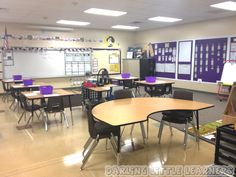 an empty classroom with desks and chairs