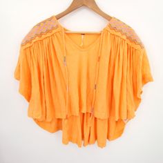 Free People Top Size Small Orange Embroidered Flowy Boho Bohemian V Neck Carrot Nwt Condition: Nwt (New With Tags) Size: Small We Are Happy To Answer Your Questions! Elevate Your Style With This Delightful Orange Embroidered Flowy Boho V-Neck Top By Free People In Size Small. Super Fast Shipping: We Ship Out The Next Business Day! Bohemian V-neck Embroidered Top, Summer Embroidered V-neck Peasant Top, Embroidered V-neck Peasant Top For Beach, Bohemian Summer Tops With Embroidered Hem, Bohemian Tops With Geometric Embroidery For Vacation, Orange Embroidered Tops For Summer, Bohemian Embroidered Top For Beach In Spring, Bohemian Summer Peasant Top With Embroidered Hem, Summer Beach Top With Geometric Embroidery