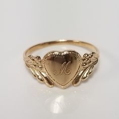 "Thanks for shopping our vintage estate store. We tend to sell well below wholesale and truly hope you enjoy all of our items. Many of the items are one of a kind, so please enjoy scrolling through the pictures and hopefully something will catch your eye. Brown spots are from camera or reflections. Estate 14k yellow gold monogram cursive capital M heart ring. Custom made ring for our shop. Ring size: 3 Setting: 7.5mm 1/4\" to 3/8\" Band width: 1.4mm Weight: 1.09 grams Marked 14k and it's sweet. 14k Gold Engraved Ring With Initials For Collectors, Personalized Engraved Yellow Gold Ring For Collectors, Classic Heart Jewelry For Collectibles, Classic Heart Shaped Collectible Jewelry, Classic Heart-shaped Collectible Jewelry, Classic Personalized Signet Ring For Collectors, Classic Personalized Collectible Signet Ring, Personalized Yellow Gold Signet Ring Collectible, Classic Gold Initial Ring Collectible