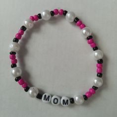 New Mom Beaded Statement Bracelet Handmade With Glass Beads Made With Durable Stretchy Elastic Cord Bright Neon Pink Beads, Pearls And Black Accent Beads Hand Crafted With Love And Care, Unique One Of A Kind They Are Sure To Bring A Pop Of Color And Style To Any Outfit While Making A Bold Fashionable Statement This Would Make A Great Gift Yourself Or Someone You Care About For Valentines Day, Mothers Day, A Birthday, Date Night, Anniversary Or Any Other Special Occasion. Contact Me If You Have A Mothers Day Clay Bead Bracelet Ideas, Trendy White 8mm Beads, Casual White Pearl Bracelets, White Beaded Bracelet For Mother's Day, White Casual Beaded Bracelets For Mother's Day, Casual Beaded Stretch Bracelet For Mother's Day, Casual White Beaded Bracelets For Mother's Day, Trendy White Beaded Pearl Bracelet, Mother's Day White Beaded Bracelets With Colorful Beads