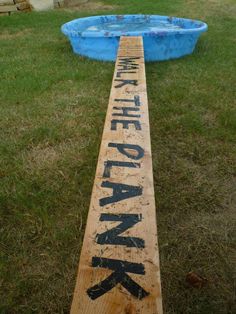 a wooden plank that has been carved into the shape of a pool with words written on it