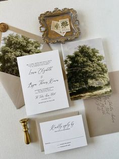 the wedding stationery is laid out on top of an envelope and some other items