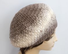 a mannequin head wearing a crocheted hat