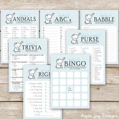 the printable baby shower game is set up on a wooden table with other items