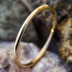 "This Gold stacking ring is entirely hand-made & mixes well with most of the items in our store. * This listing is for (1) one ring. * Made with: 16g (1.29 mm) 12k Yellow Gold-filled wire. * When stacked, they measure at about 7 rings per half inch. * We do make 1/2 & 1/4 sizes, just leave a note with your size preference. * All of our items are entirely hand crafted and have a standard processing time of 3-5 Business days to make the order. * Items are processed in the order they are pu Classic Stackable Toe Rings, Yellow Gold Stackable Round Midi Rings, Stackable Round Yellow Gold Midi Rings, 14k Gold Stackable Round Bands, Stackable Yellow Gold Couple Rings, Yellow Gold Stackable Couple Rings, Classic 14k Gold Hoop Rings, Stackable 14k Gold Couple Rings, Yellow Gold Stackable Bangle Rings As Gift