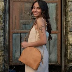 Designed for life on the go, this is a great crossbody bag that you'll hardly feel you are carrying. Remove the strap and make it a clutch! FREE SHIPPING (US Domestic) Handmade in India Materials: full grain leather; hand-block printed lining Dimensions: 10.5 in. L x 8 in. H x 2.5 in. D; adjustable crossbody strap 57 inches. Full zip close; 2 exterior open pockets, 1 interior zipped pocket; fully lined Have you considered a Zee Bee Market Gift Card? A meaningful gift that lets your recipient dec Camel Crossbody Shoulder Bag With Leather Handles, Camel Crossbody Shoulder Bag For On-the-go, Everyday Camel Crossbody Bag, Camel Bags For Everyday Use, Leather-lined Saddle Bag For On-the-go, On-the-go Cognac Shoulder Bag, Camel Shoulder Bag With Adjustable Strap For Everyday Use, Camel Shoulder Bag With Detachable Strap For Everyday, Leather Handles Saddle Bag For Travel