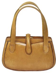 This is an early Gucci leather tan handbag from the 1940's or earlier, with a fabric label in the interior that says: Gucci Firenze V.Vigna Nuova Roma V. Condotti The estate sale representative relayed that the handles appeared to have been replaced at some point in time. Measures 7" height x 10 1/2" length x 2" depth. The strap drop is 6". The purse is in very good vintage condition with some scuffs and marks (see photos). The clasp works. Free domestic shipping with careful packaging, shipping Everyday Handheld Gucci Satchel, Gucci Brown Shoulder Bag With Brass Hardware, Brown Gucci Shoulder Bag With Brass Hardware, Gucci Leather Bags With Brass Hardware, Gucci Shoulder Bag With Brass Hardware For Evening, Gucci Leather Satchel For Daily Use, Gucci Formal Shoulder Bag With Brass Hardware, Rectangular Gucci Satchel For Evening, Gucci Shoulder Bag With Brass Hardware For Formal Occasions