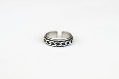 Silver plated cuban chain style ring for men.- Ring material: silver plated- Adjustable size, the ring can be adjusted.- Ring thickness: 0.2 inch (0.5cm)This ring is great as a gift for a man or a boy. All of our jewelry comes wrapped and ready for gift giving!Visit our shop for more similar items: http://www.etsy.com/shop/principles Adjustable Metal Chain Ring, Minimalist Silver Midi Rings With Adjustable Chain, Silver Rings With Adjustable Chain For Everyday, Minimalist Metal Rings With Adjustable Chain, Stainless Steel Rings With Adjustable Chain For Gift, Silver Sterling Chain Ring Tarnish Resistant, Minimalist Metal Chain Promise Ring, Minimalist Adjustable Sterling Silver Chain Ring, Adjustable Minimalist Sterling Silver Chain Ring