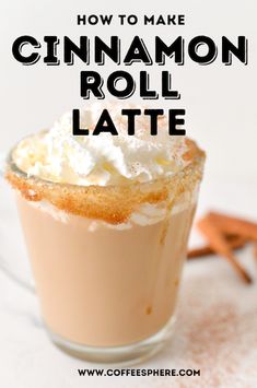 cinnamon roll latte with whipped cream on top in a glass cup and cinnamon sticks next to it