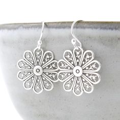 Tiny Silver Earrings Floral Filigree Earrings Silver Flower Earrings Silver Drop Earrings Silver Jewelry Gift for Her - Modern Edge A modern twist on a classic pair of earrings. Simple, lightweight and utterly perfect for everyday wear for yourself or to give as a gift.  Lightweight and delicate, these earrings have a dainty round floral shape. Simply suspended from Sterling Silver earwires, the total length of these earrings from the top of the earwires to the bottom of the components is a PETI Adjustable Drop Flower Earrings, Filigree Flower Earrings, Hypoallergenic Flower Shape Earrings, Adjustable Flower-shaped Earrings For Pierced Ears, Silver Filigree Flower Earrings, Delicate Nickel-free Flower-shaped Earrings, Flower Earrings Silver, Floral Filigree, Drop Earrings Silver