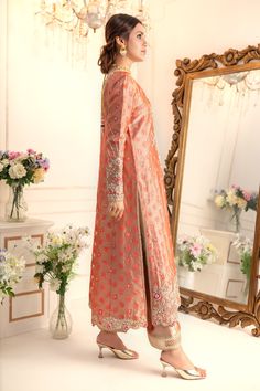 Elevate your style quotient this wedding season, with this romantic multi- paneled A-line shirt, beautifully adorned with botanical embroidery with dabka, pearls, kundan, glistening sequins, delicate beads and resham work. This relaxed fit shirt is paired with gota detailed izaar and two tone katan silk jacquard dupatta adorned with gota and sequin embellishments to complete the festive look of this outfit Shirt Fabric: Pure jacquard Soft tissueShirt Length: 48” (customisable, mention in order n Botanical Embroidery, Embroidery Fashion Detail, Chikankari Suits, Resham Work, Designer Outfit, Desi Wear, Pakistani Wedding Outfits, Festive Look, Katan Silk