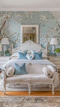 a bedroom with blue and white wallpaper and furniture