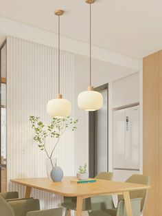 a dining room table with chairs and a vase on the table next to two hanging lights