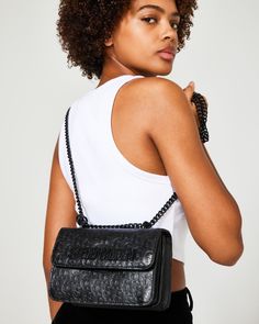 POLISHED + EFFICIENT + SHARP The structured COAL Bag crossbody bag is designed with expandable side gussets so you'll have plenty of room for all your essentials. Structured crossbody bag Flap closure at front All-over embossed logo pattern Removable logo tag Chain strap for crossbody and over-the-shoulder wear Crossbody strap drop: 24 inches 5.5in H x 8in W x 3.25in D Synthetic materials Imported Wardrobe Upgrade, Branded Shoes For Men, Steve Madden Store, Crossbody Bag Women, Logo Tag, Synthetic Materials, Logo Pattern, Summer Events, Women's Handbags