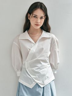 This is We’Dee’s shirt features a clean look with an asymmetrical design that adds a unique touch. The front has two buttons for easy wear and removal, serving as a focal point of the look.- Perfect for daily wear- Can be paired with different styles of bottoms to create various looks- The clean design makes it easy to style with any outfit Asymmetrical Shirt Outfit, Assymetrical Top Outfits, Surface Development, Deco Fashion, Asymmetrical Shirt, Outfit Styling, White Shirts Women, Fashion Hacks Clothes, Basic Shirts